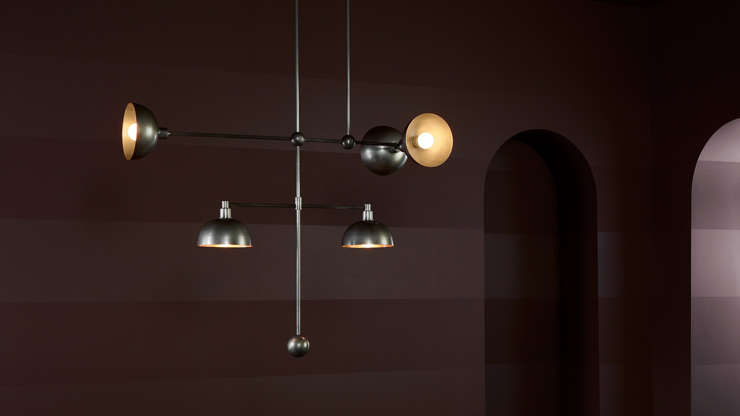 An illuminated TRAPEZE : 5 MOBILE ceiling pendant in Tarnished Silver finish. 