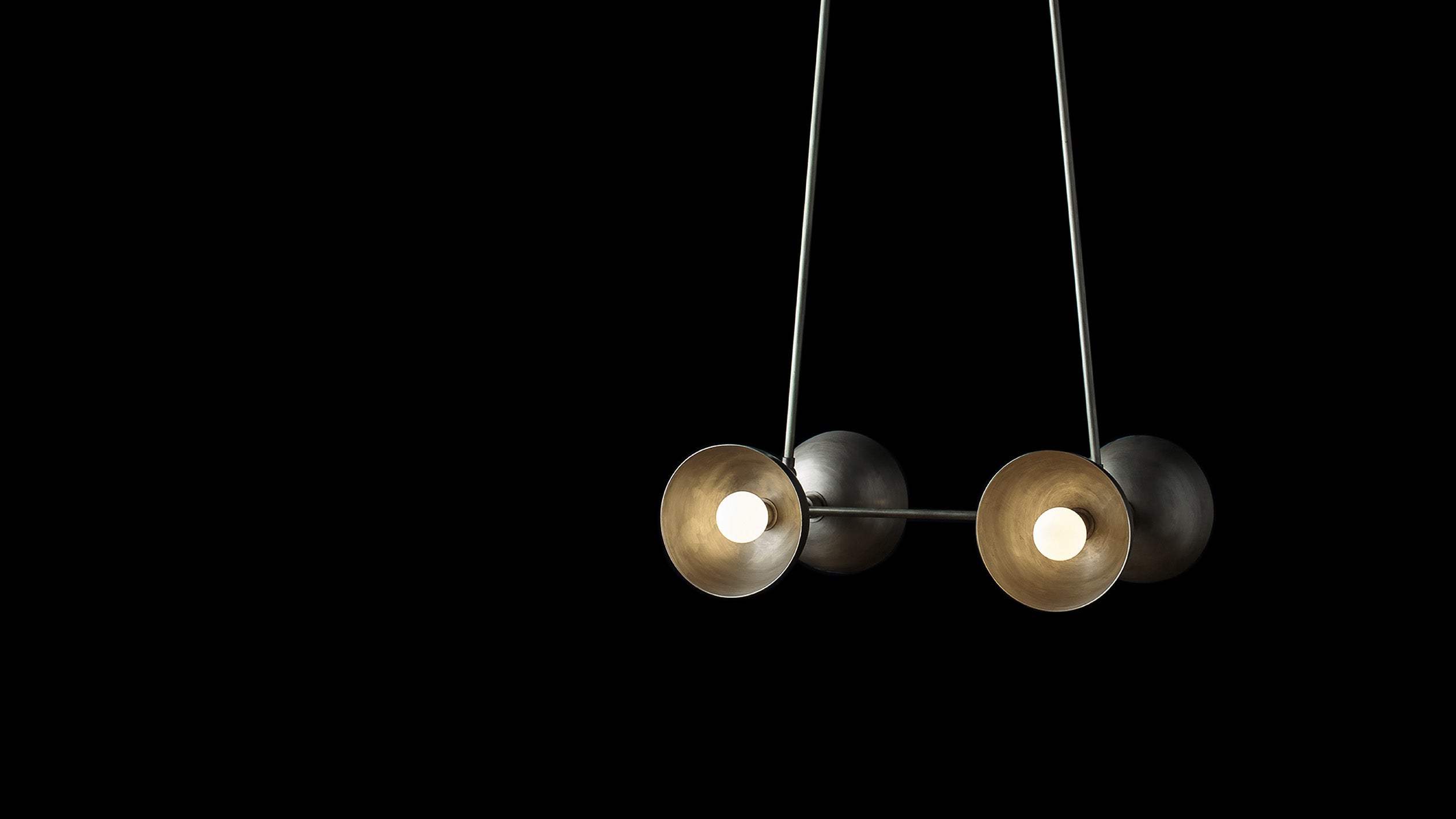 TRAPEZE : 4 ceiling pendant in Tarnished Silver finish hanging against a black background. 
