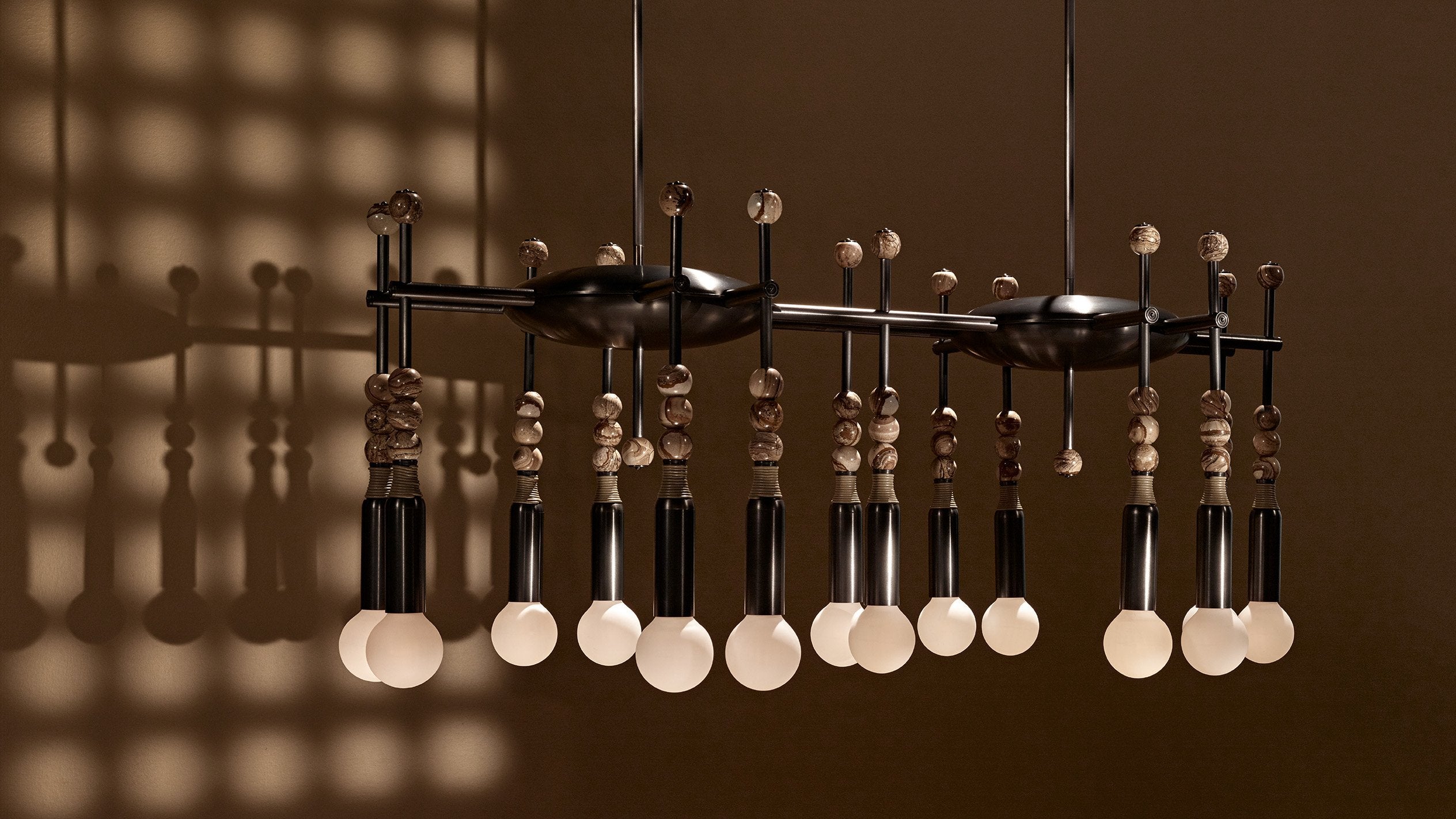 TALISMAN : 14 chandelier in Oil-Rubbed Bronze and Tan Leather, with Desert Jasper stone. 
