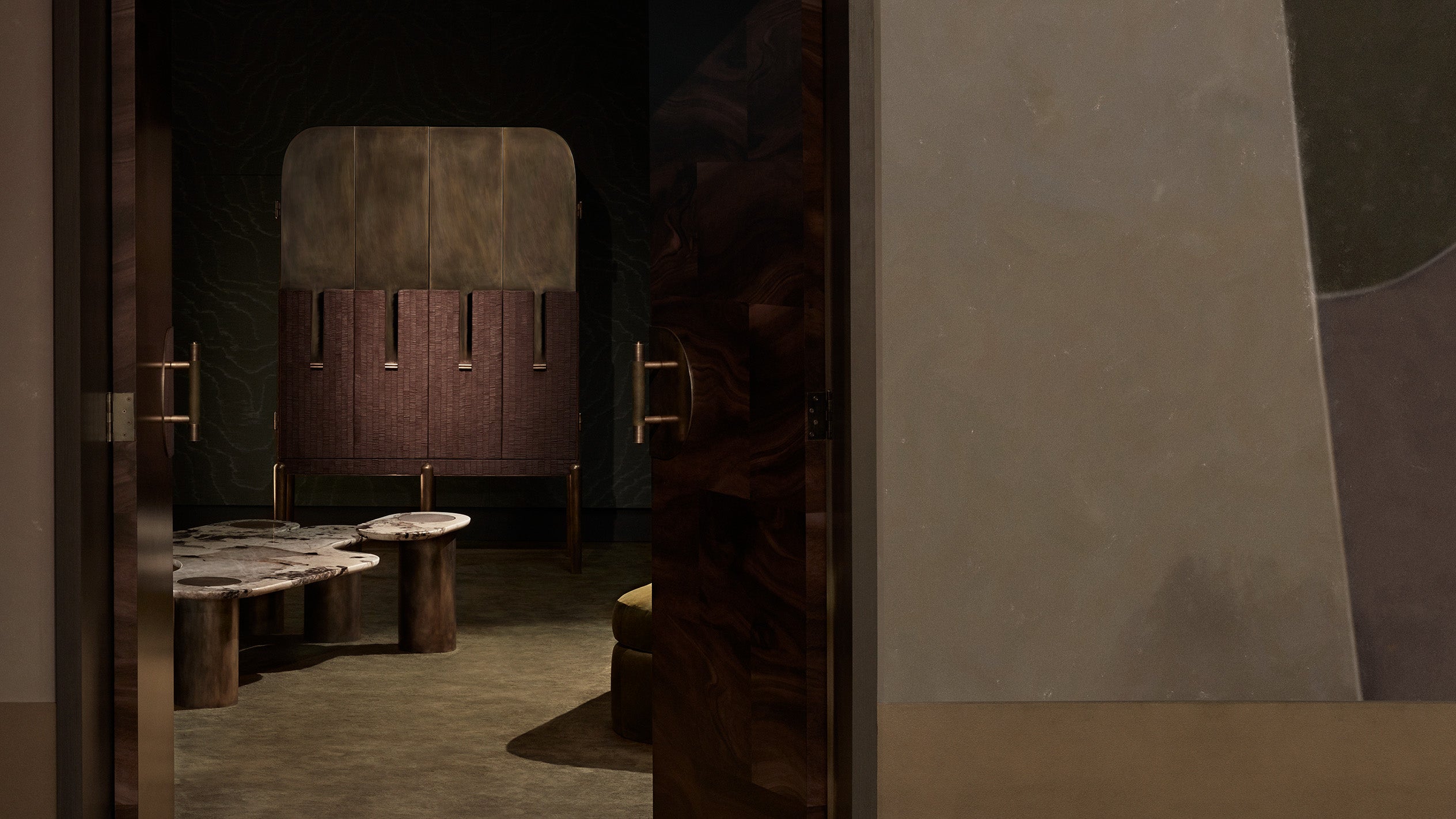 The view from outside a room decorated with the INTERLUDE : CABINET VARIATION 02 and marble table. 