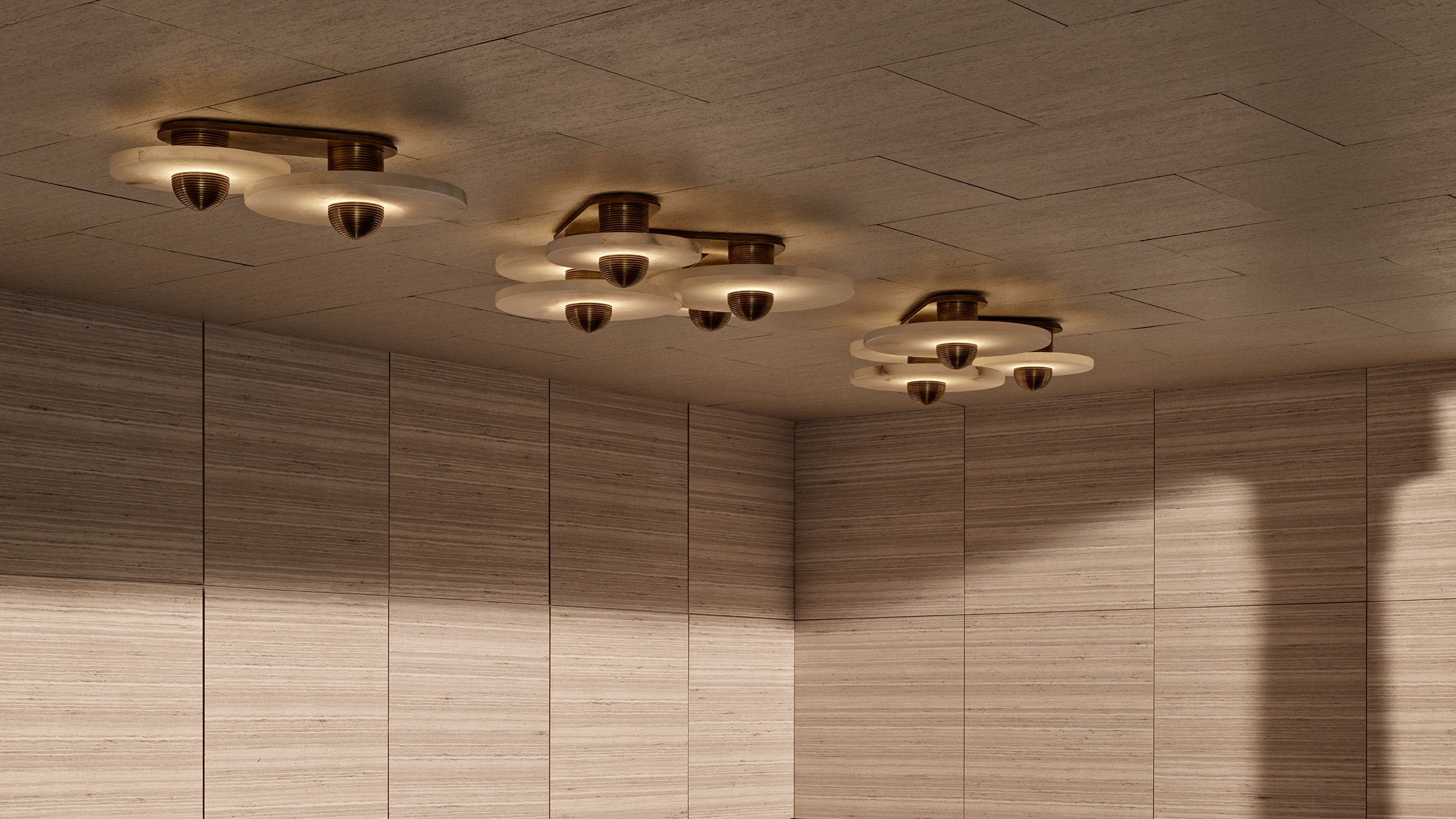 A trio of MEDIAN surface lights in an assortment of sizes, mounted to a ceiling. 