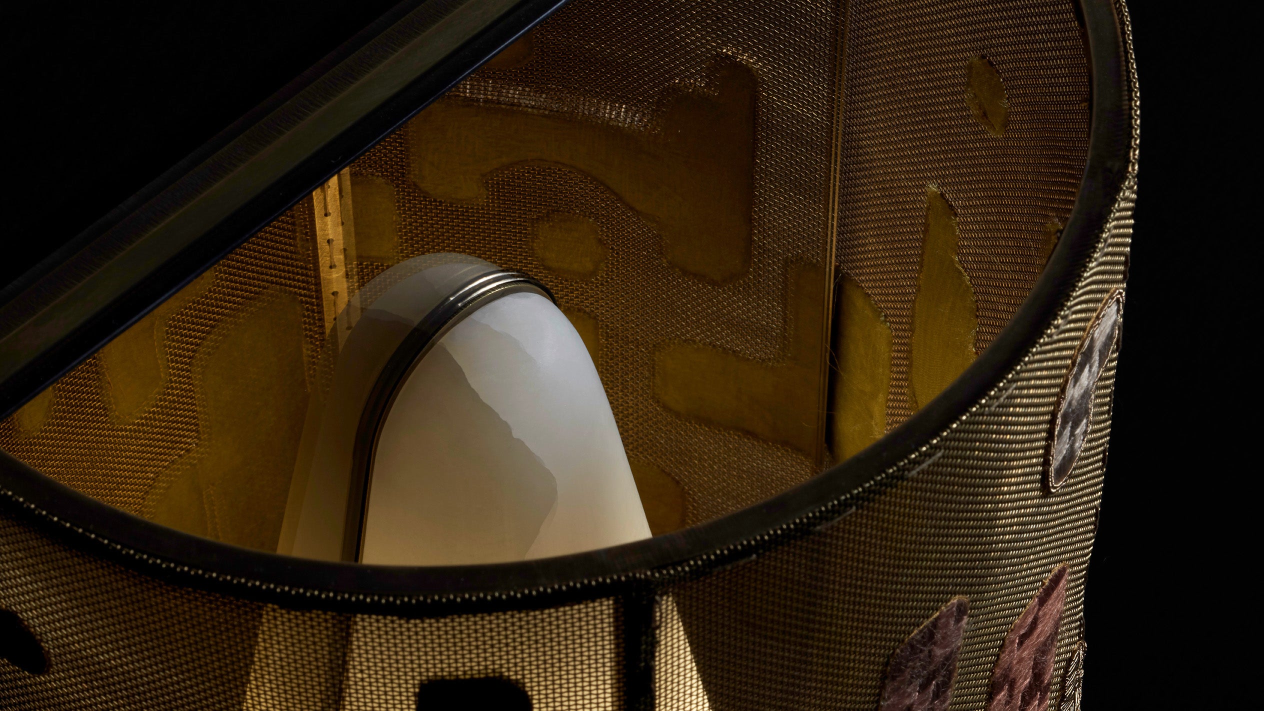 Top-view of an INTERLUDE wall sconce showing its interior.