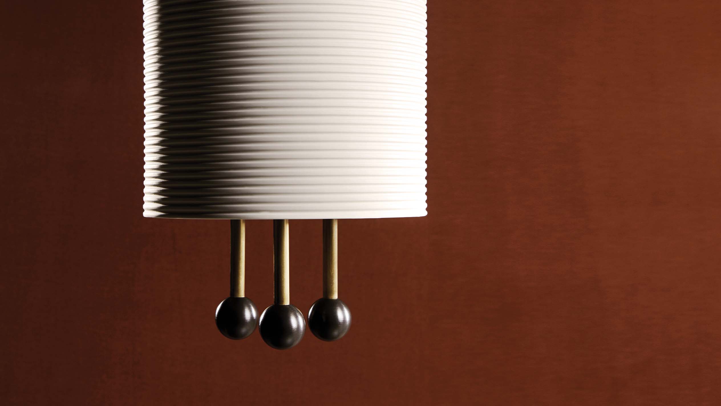 Close up of the LANTERN ceiling pendant showing details of the shade and the Aged Brass / Blackened Brass finish. 