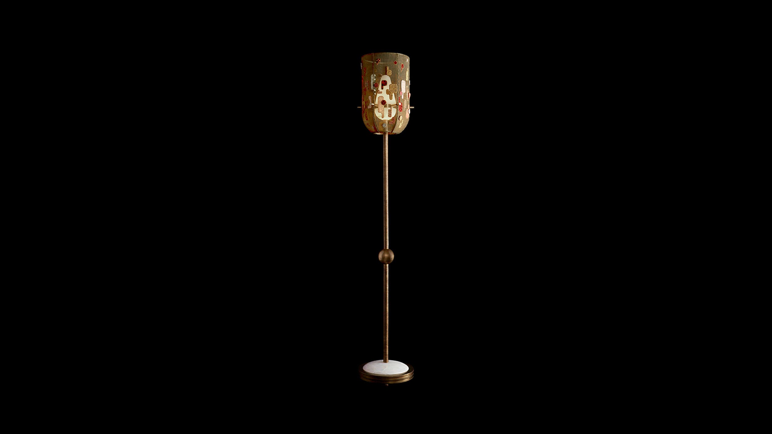 Hand-embroidered INTERLUDE floor lamp shown against a black background. 