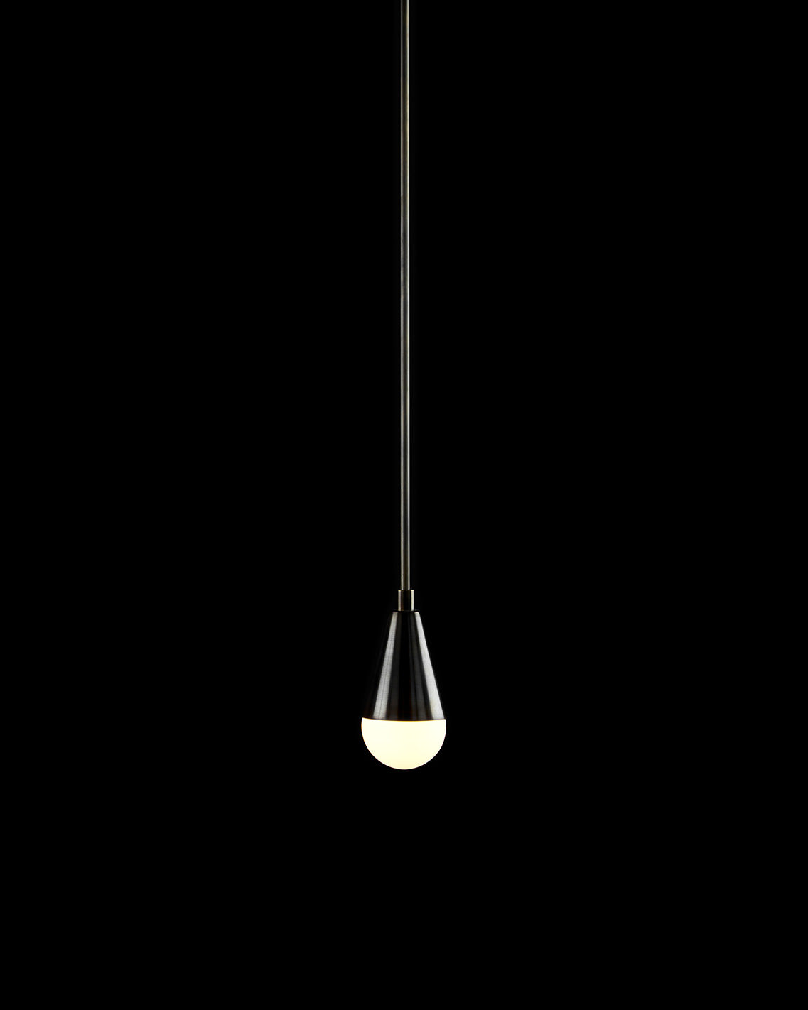 TRIAD : 1 ceiling pendant in Blackened Brass finish, against a black background. 
