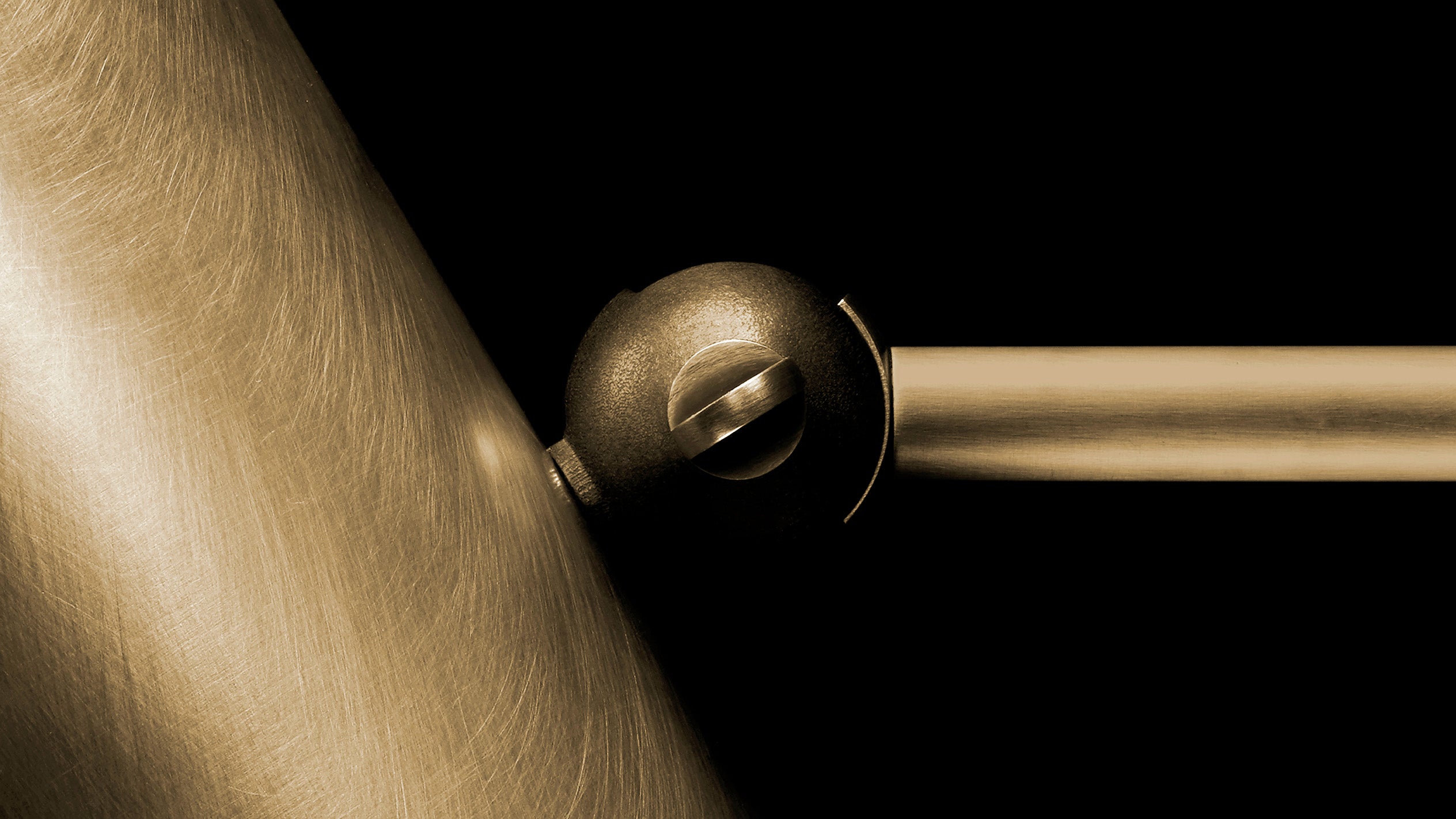 Close up of CYLINDER articulating reading sconce showing details of the Aged Brass finish. 