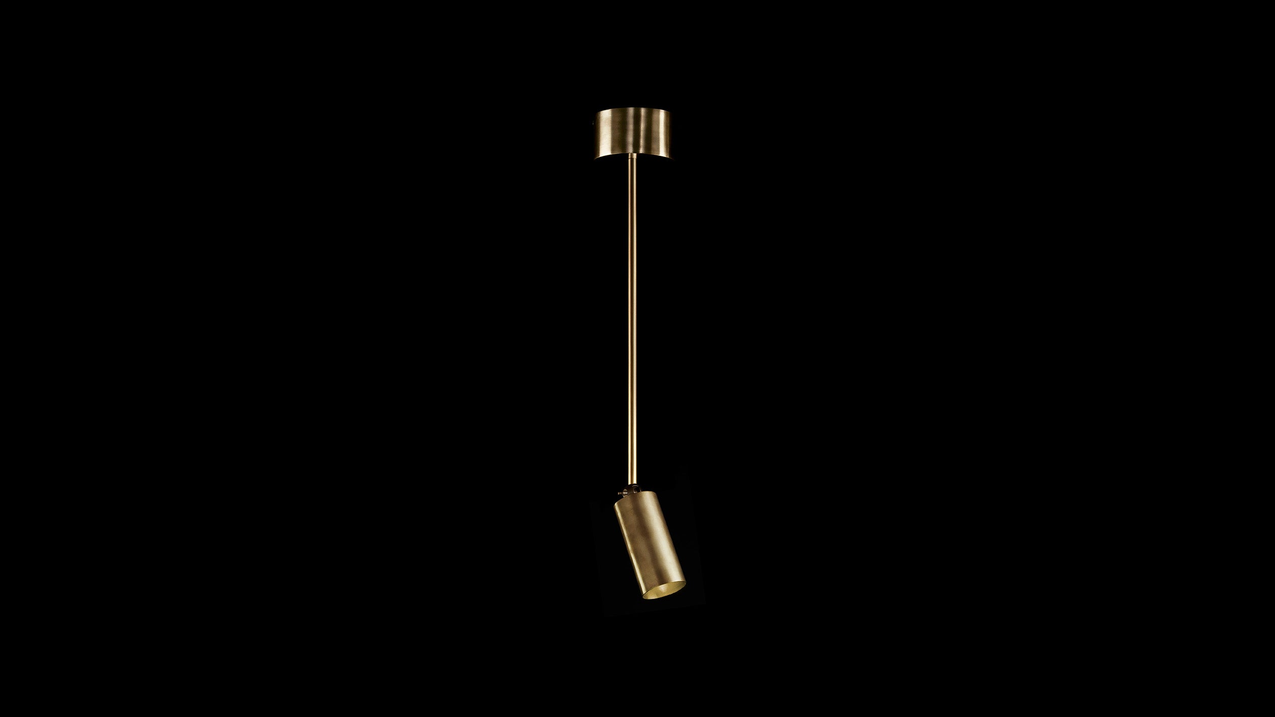 CYLINDER : DOWNLIGHT EXTENDED ceiling pendant in Aged Brass finish, against a black background. 