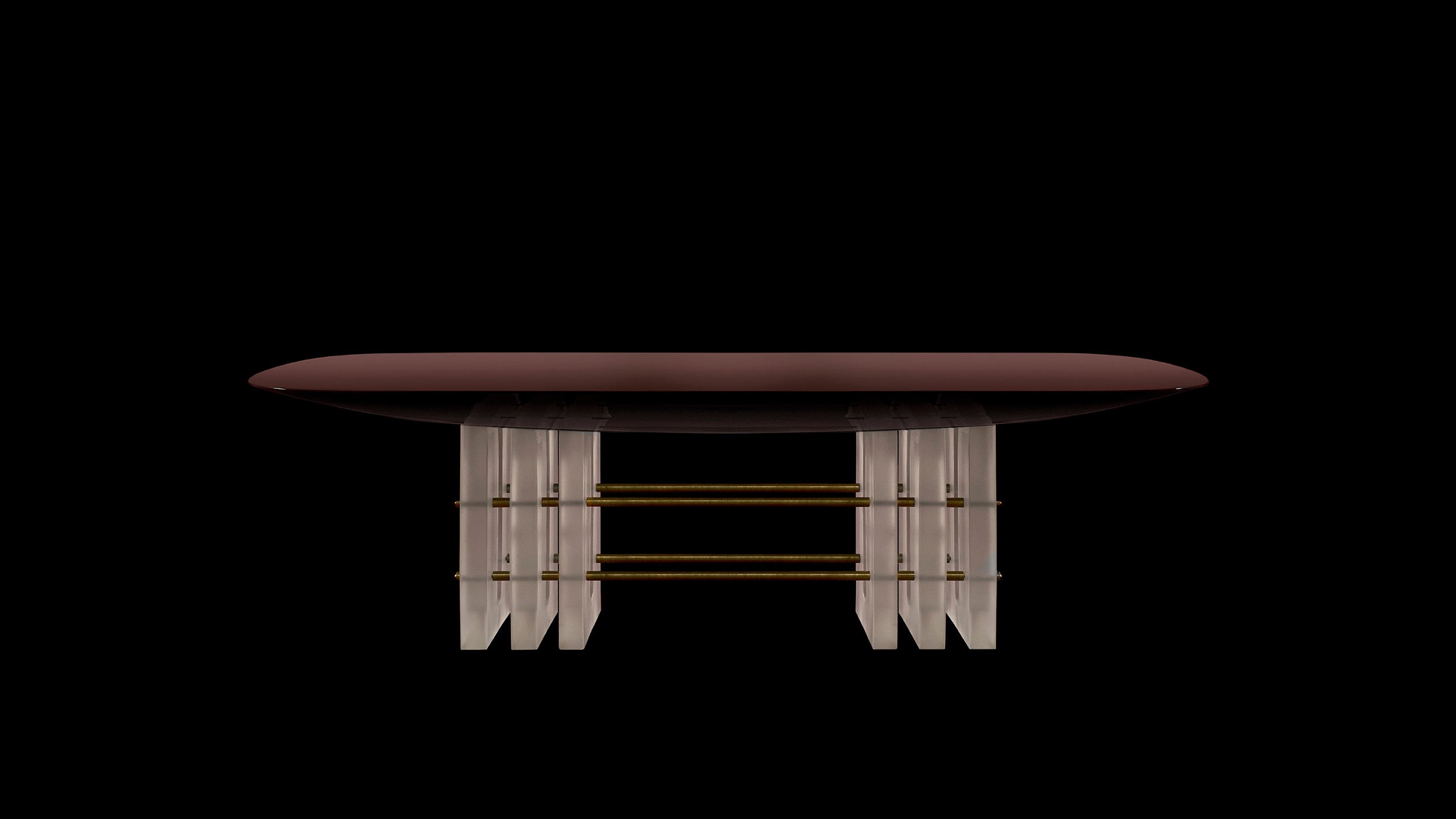 SEGMENT dining table in Oxblood Lacquer, against a black background. 