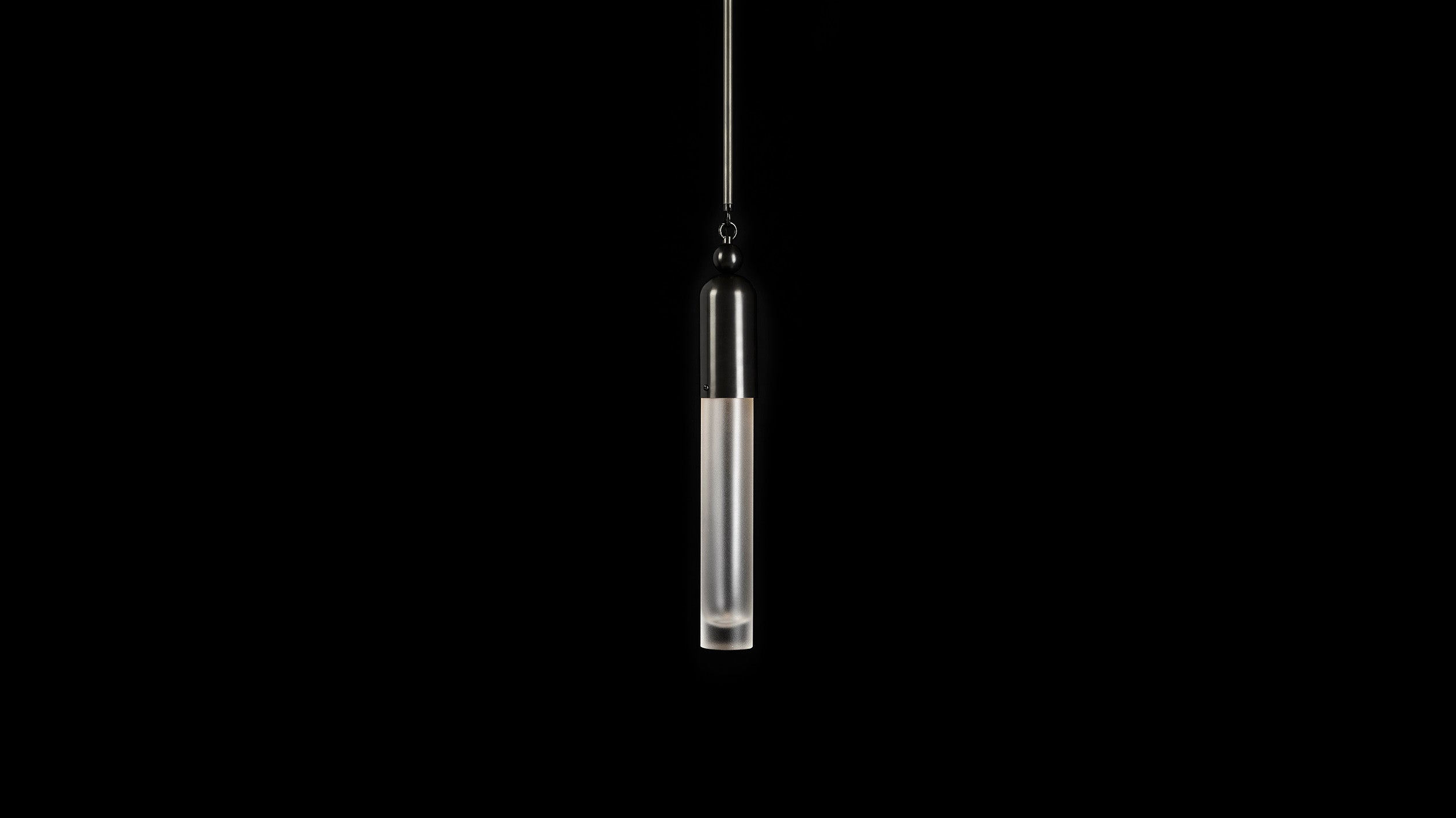 TASSEL : 1 ceiling pendant in Blackened Brass finish, hanging against a black background. 