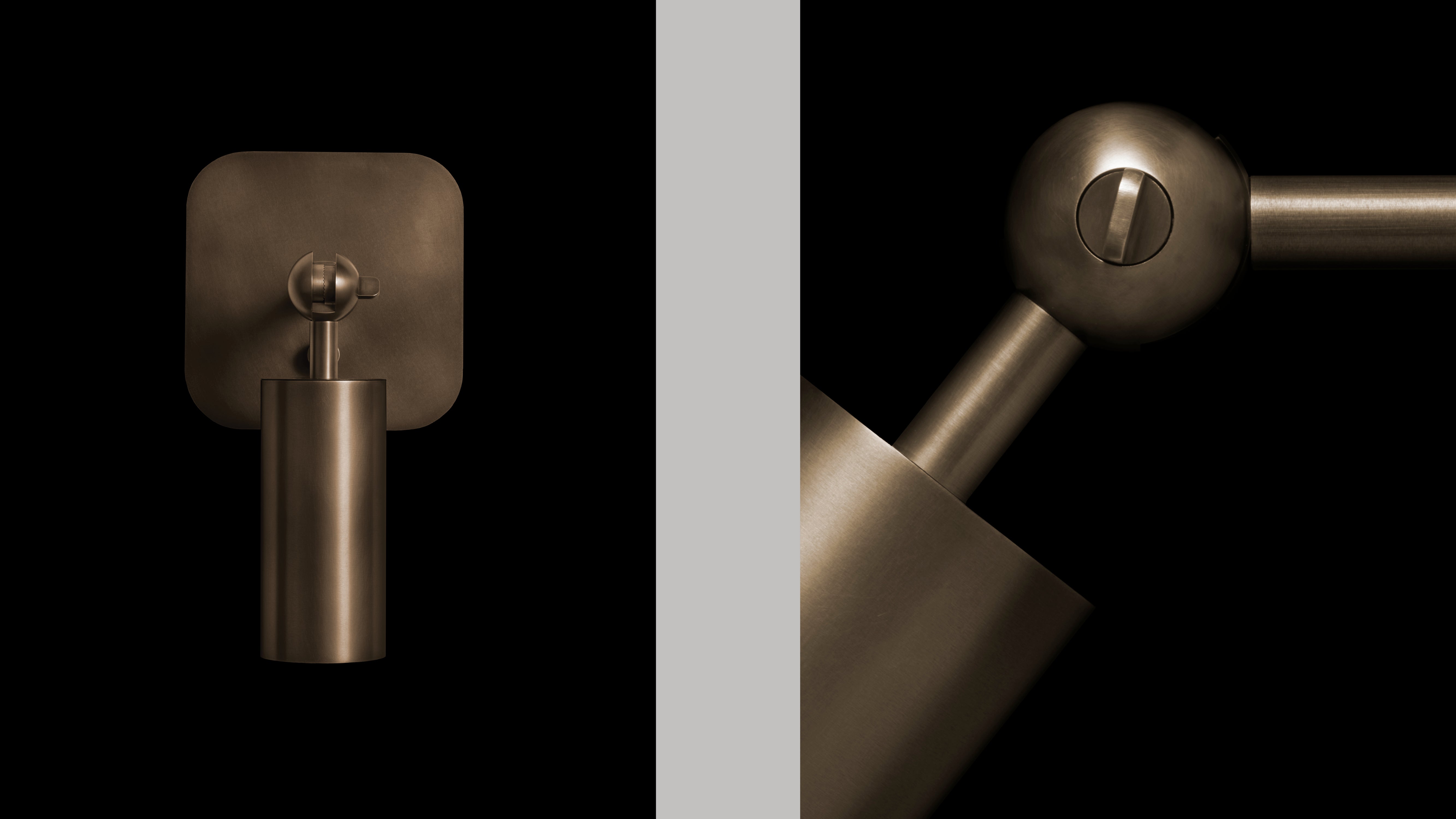 CYLINDER wall sconce in Aged Brass finish, alongside a close up of an angled lamp head. 