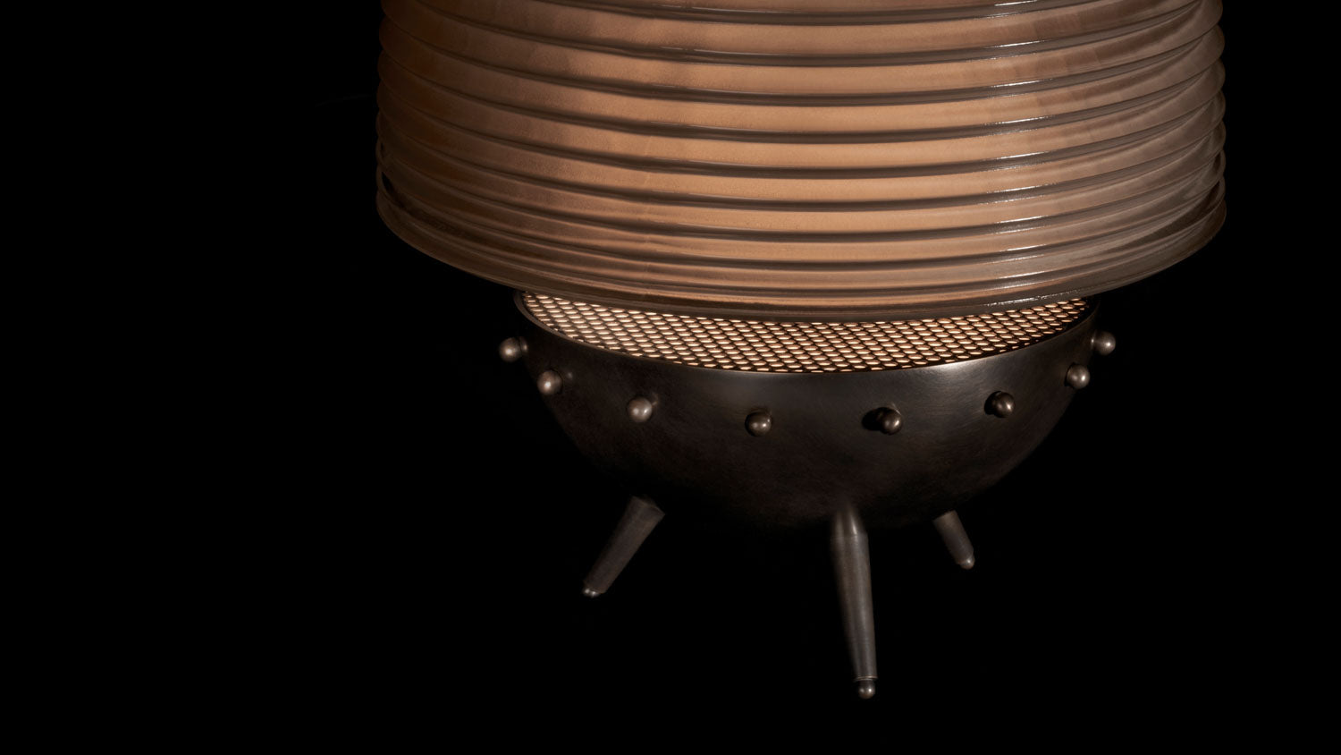 Close up of a SIGNAL : X table lamp showing details of the Oil-Rubbed Bronze finish and Smoked Glass. 