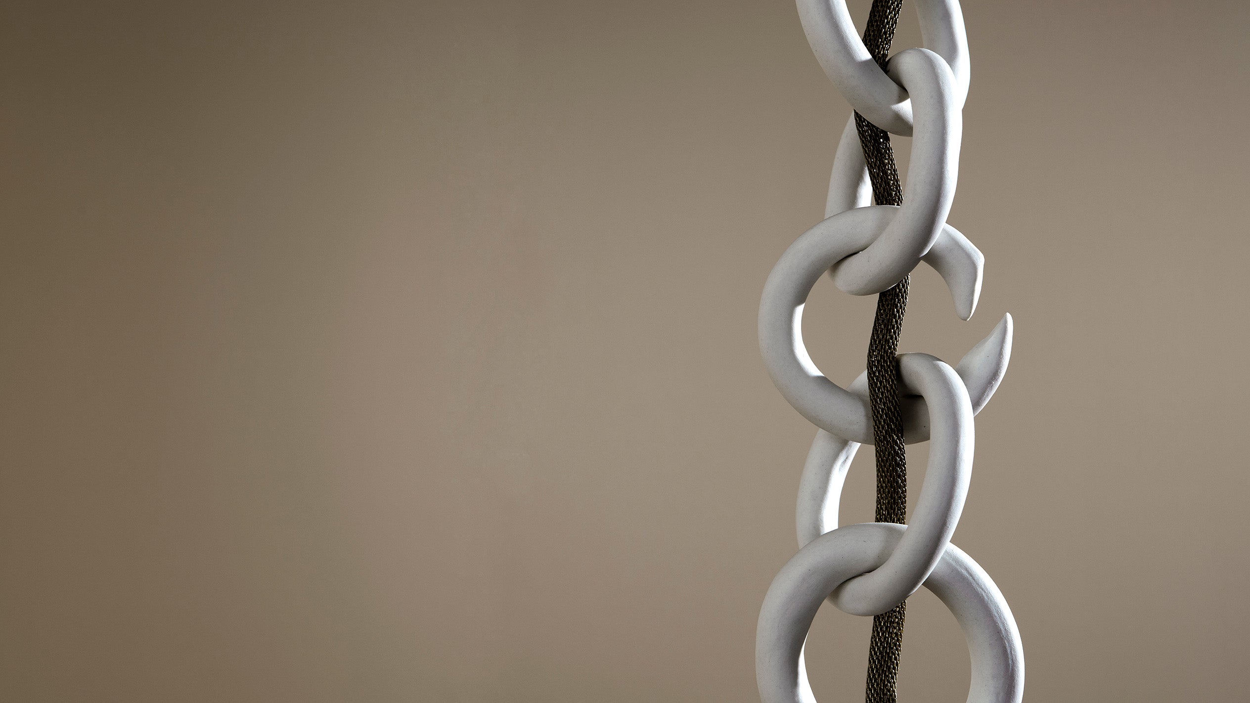 Close up of the LINK ceiling pendant chain and mesh. 