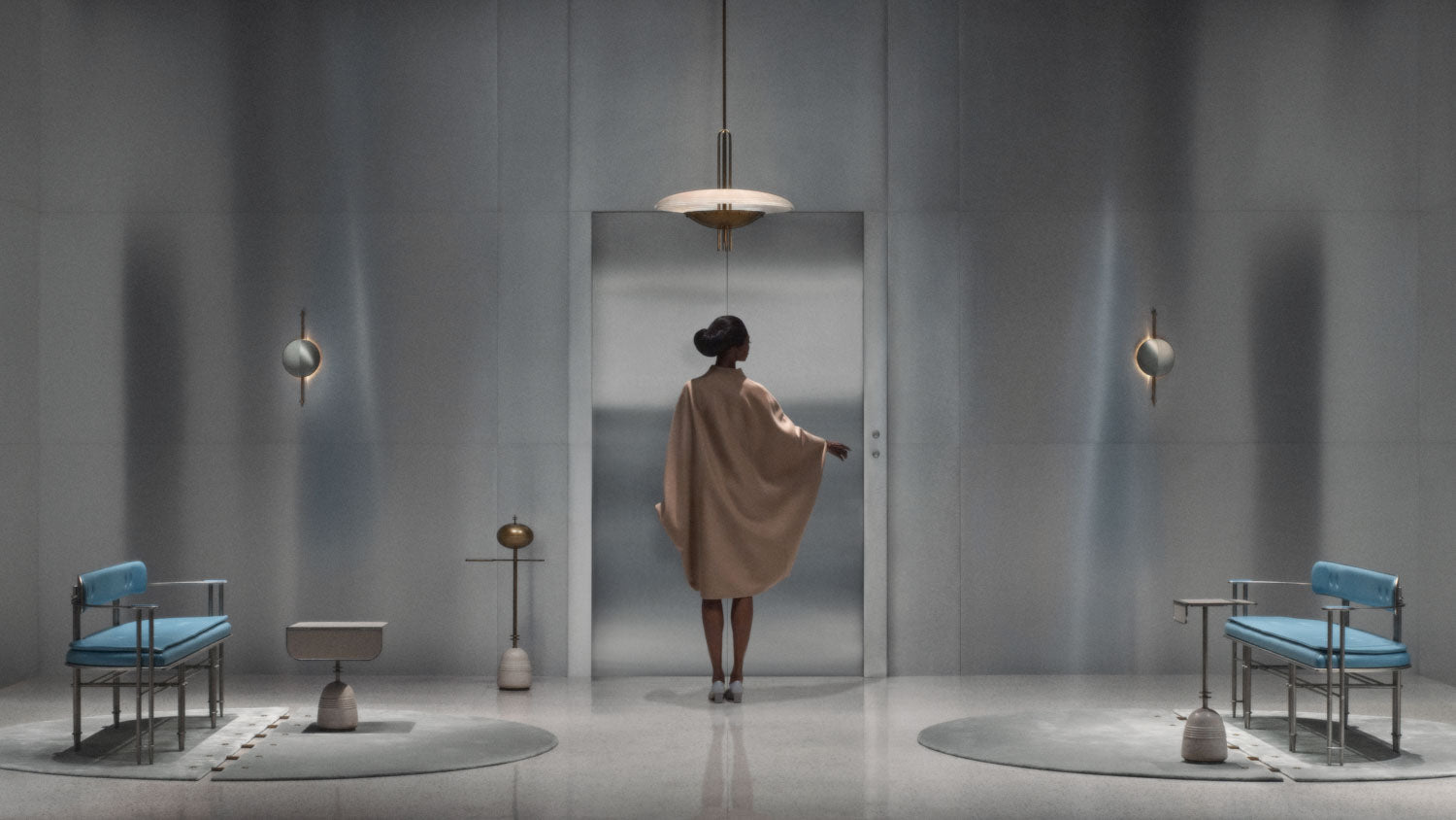 A woman is standing at an elevator in a room with two EPISODE settees either side and a SIGNAL : Y ceiling pendant hanging overhead. 