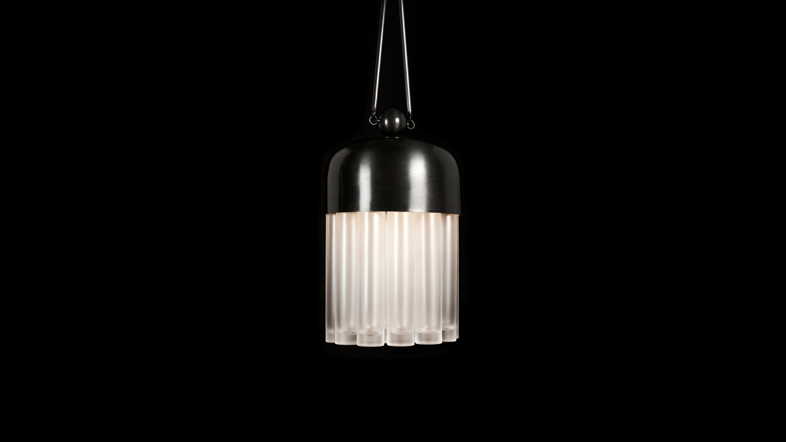 TASSEL : 19 ceiling pendant in Tarnished Silver finish, hanging against a black background. 