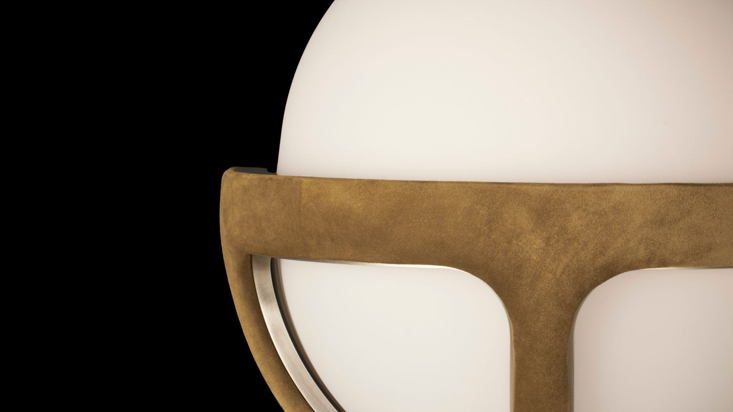 Close up of the REPRISE sconce showing details of the Bronze Suede and Tarnished Silver.