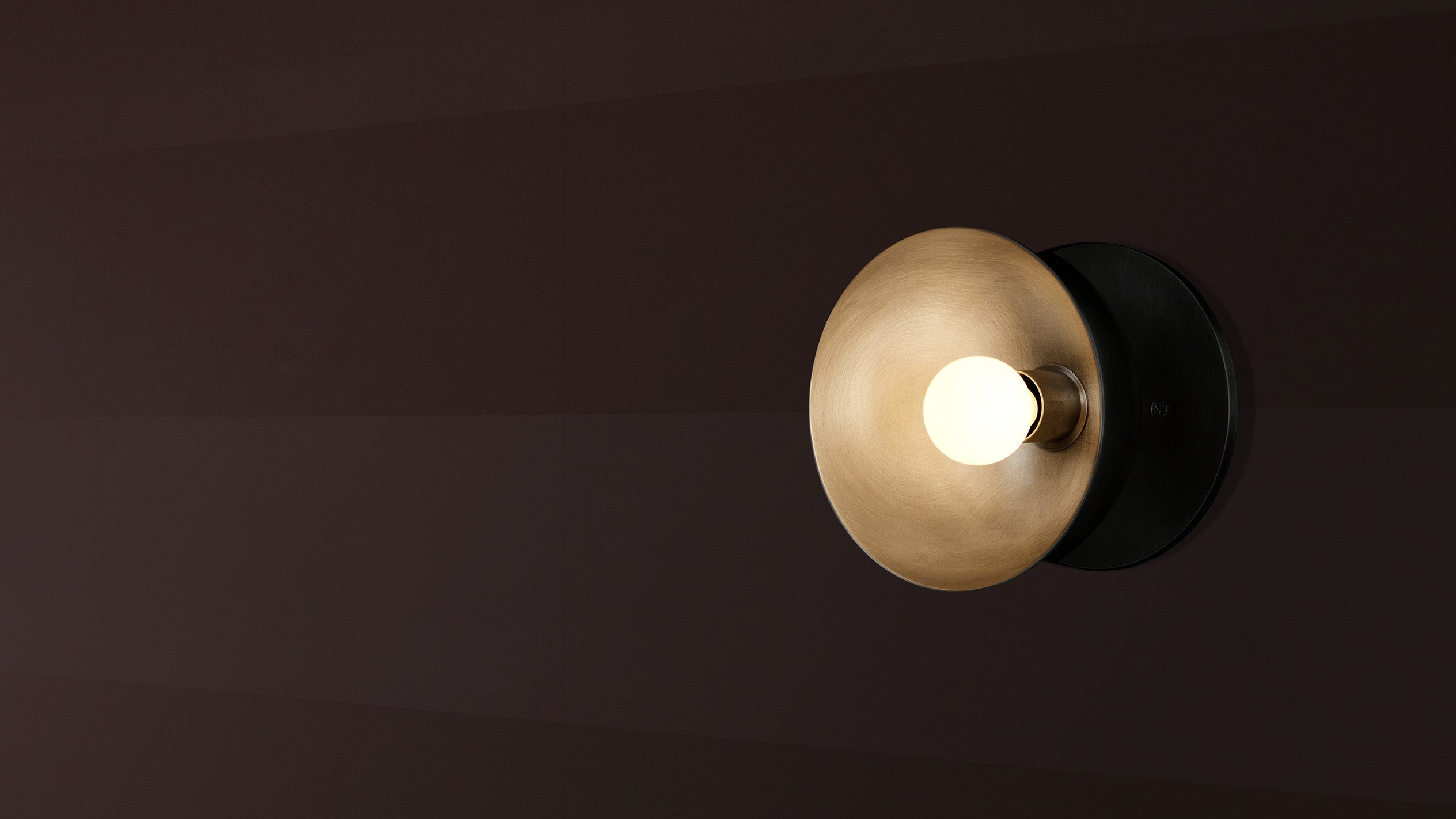 An illuminated TRAPEZE : 1 surface mounted light in Tarnished Silver finish. 