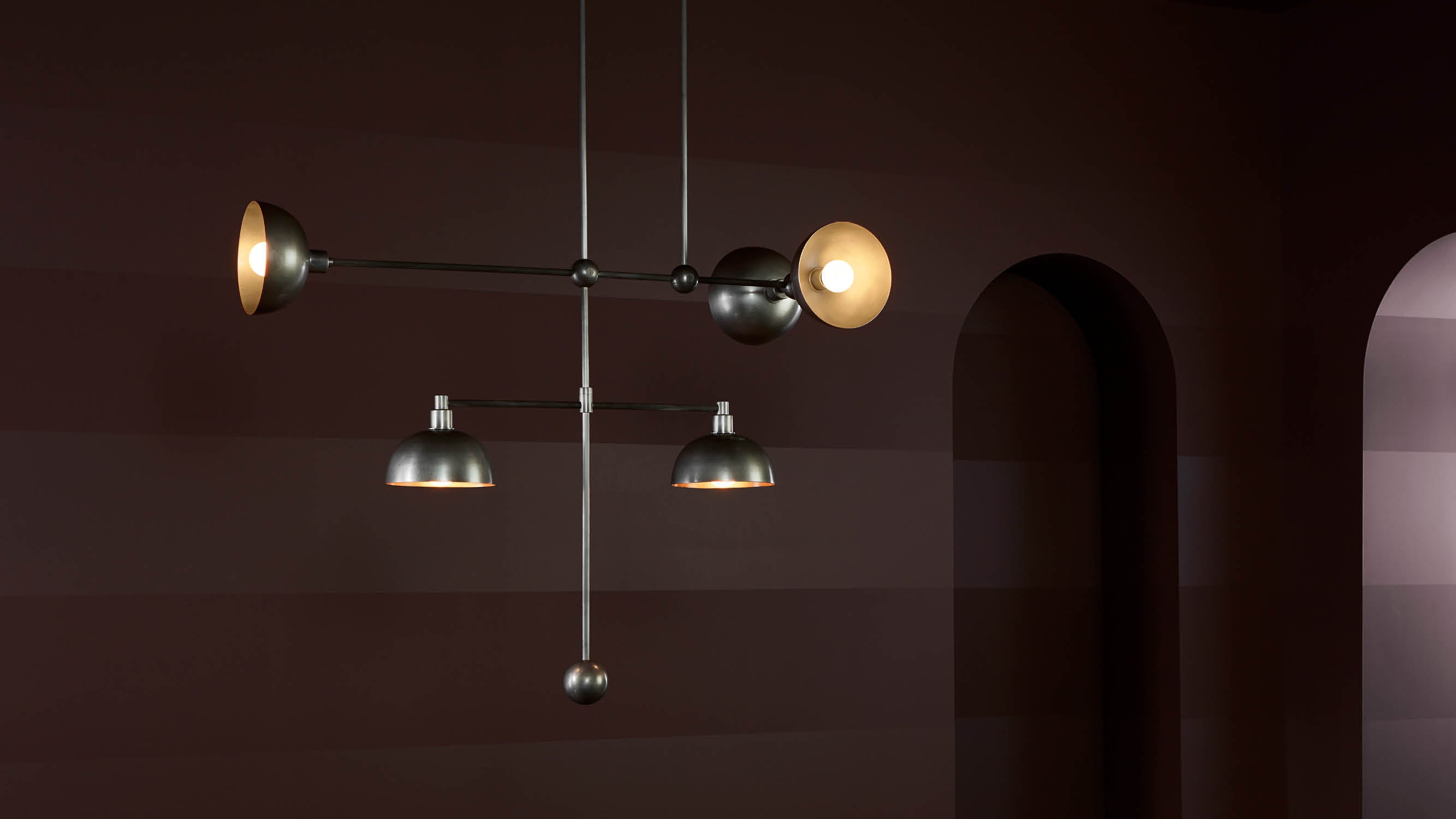 An illuminated TRAPEZE : 5 MOBILE ceiling pendant in Tarnished Silver finish. 