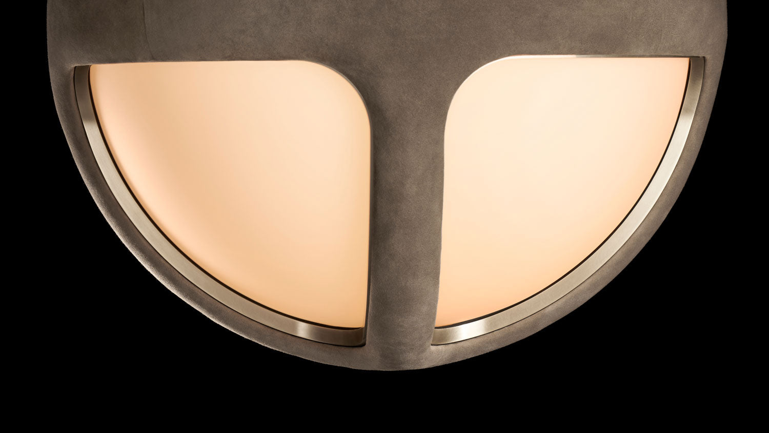 Close up of an illuminated REPRISE ceiling mounted light, showing details of the glass, Pewter Suede and Tarnished Silver finish.