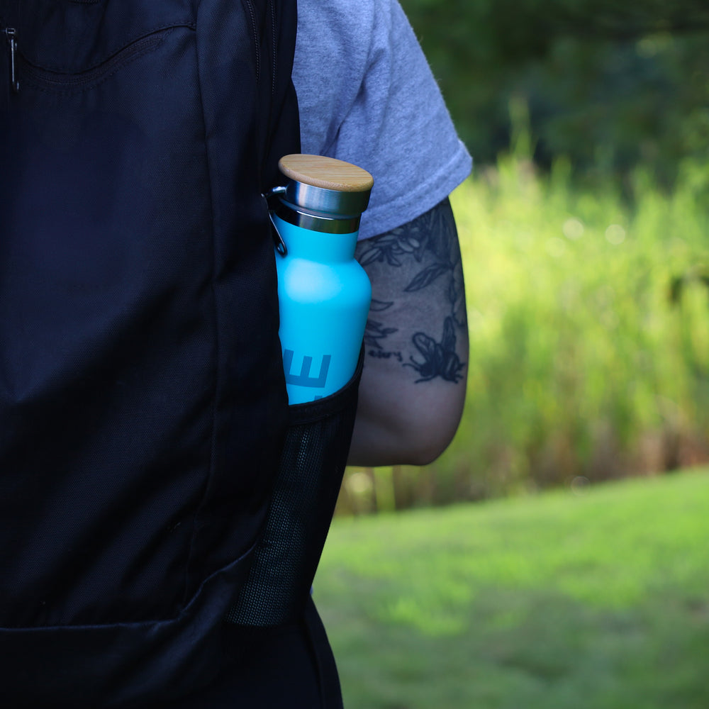 tea flask in backpack walking outside