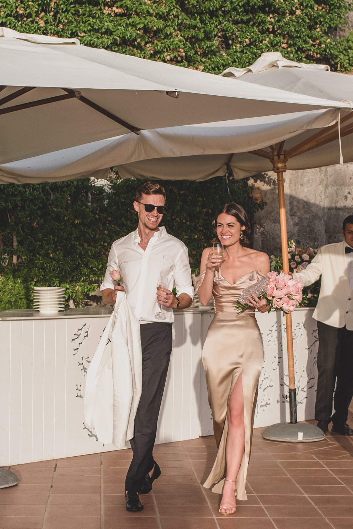 Our bride Faye on her wedding day wearing a bespoke top and skirt set made from champagne silk by us