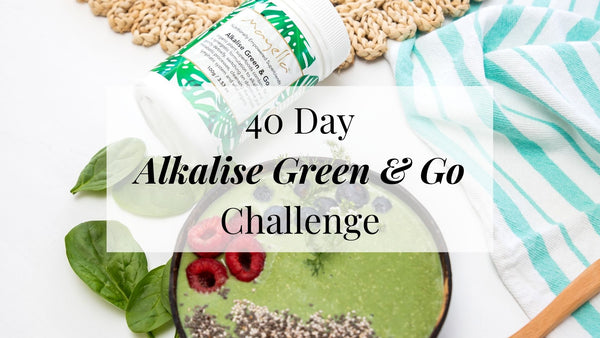 green smoothie bowl topped with berries with text overlay reading 40 Day Alkalise Green & Go Challenge