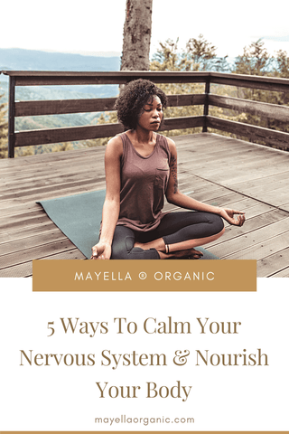 Pinterest image for this blog post. The photo in the top half is the same photo as above of the woman meditating outdoors. The bottom half is the name of the blog post in gold text that reads "5 Ways To Calm Your Nervous System and Nourish Your Body"