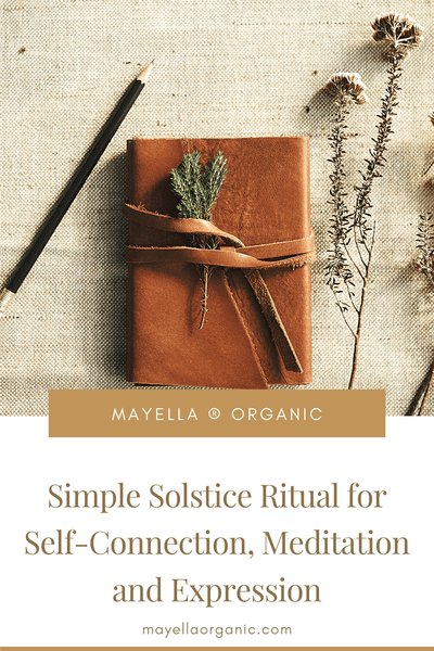 pinterest image with a photo a leather-covered journal next to wild foliage next to text that reads: Simple Solstice Ritual for Self-Connection, Meditation and Expression