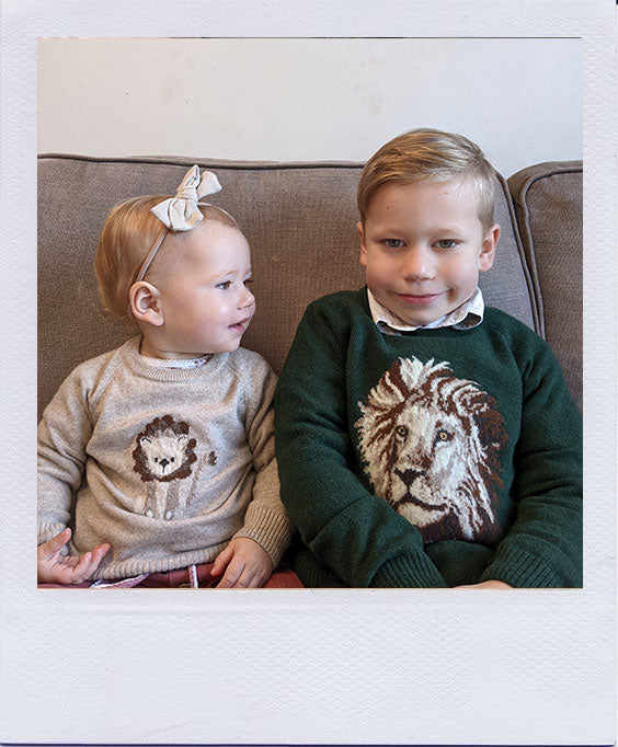 Matheson and Isabel in their Augustus Lion Jumpers