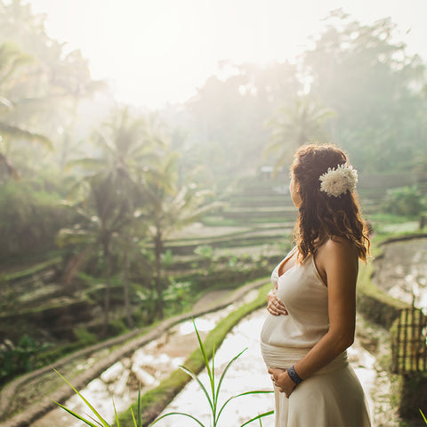 Expecting mom in Bali wearing Blisslets morning sickness wrist bands
