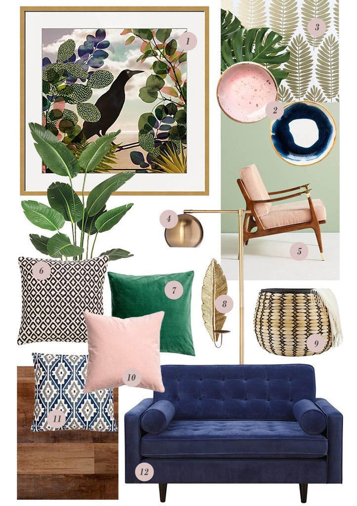 Boho interior design, decor for the living room which includes a pink mid century accent chair, dark blue tufted sofa, brass floor lamp, pink and blue dishware accessories, indoor tropical plant and patterned pillows. Blue, pink and green living room decor.