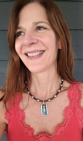 rudyblu designer wearing labradorite pendant leather choker necklace with red tank top