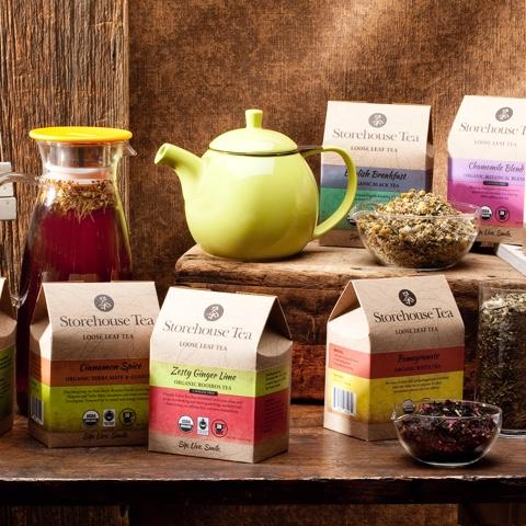 green teapot surrounded by boxes of Storehouse tea