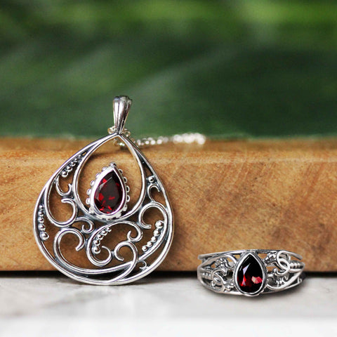 swirly garnet pendant and a pear shaped garnet ring in sterling silver