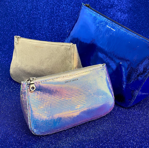 blue zipper pouch, iridescent zipper pouch and a small gold zipper pouch