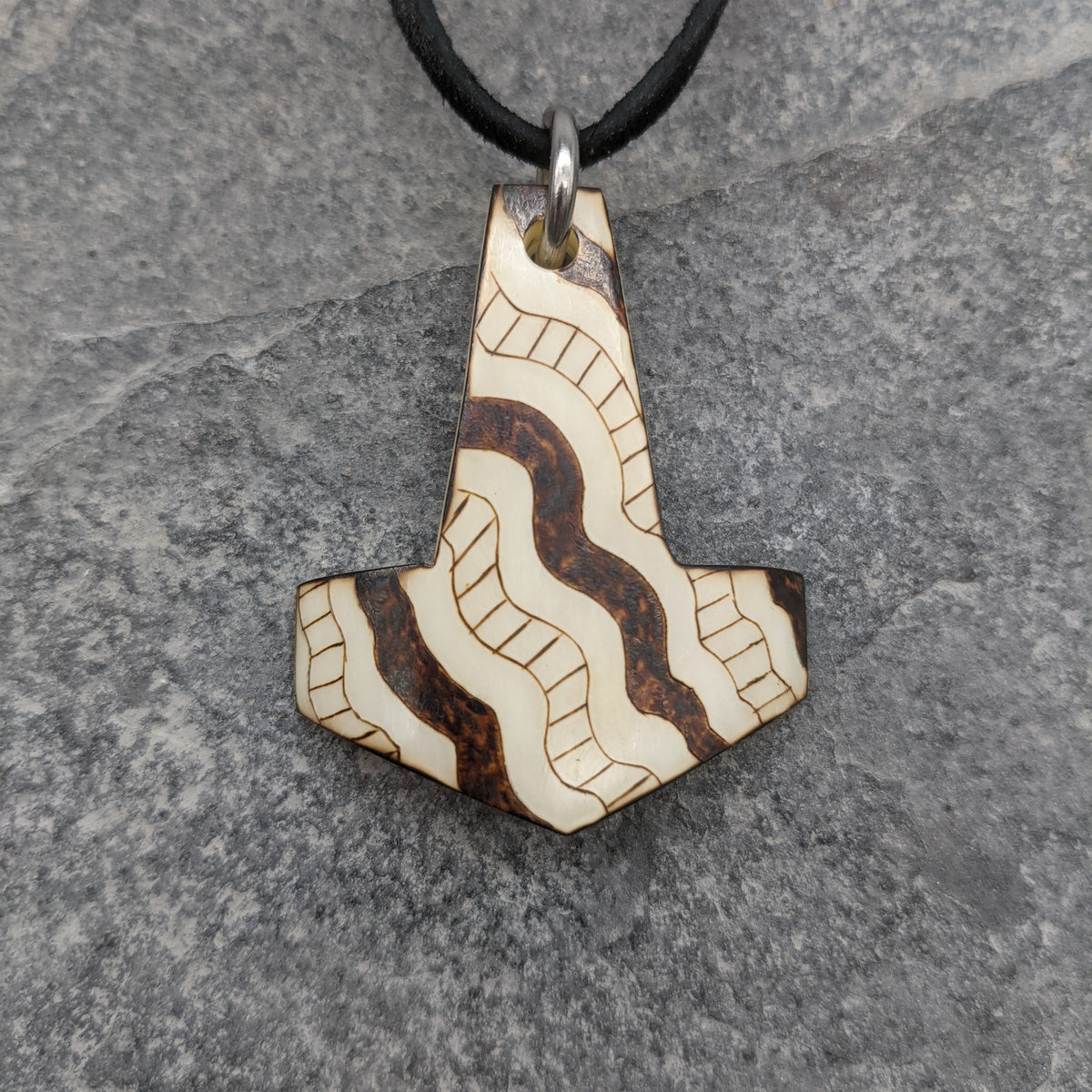 Buffalo Bone Snake Medicine Mjolnir Pendant on black leather thong