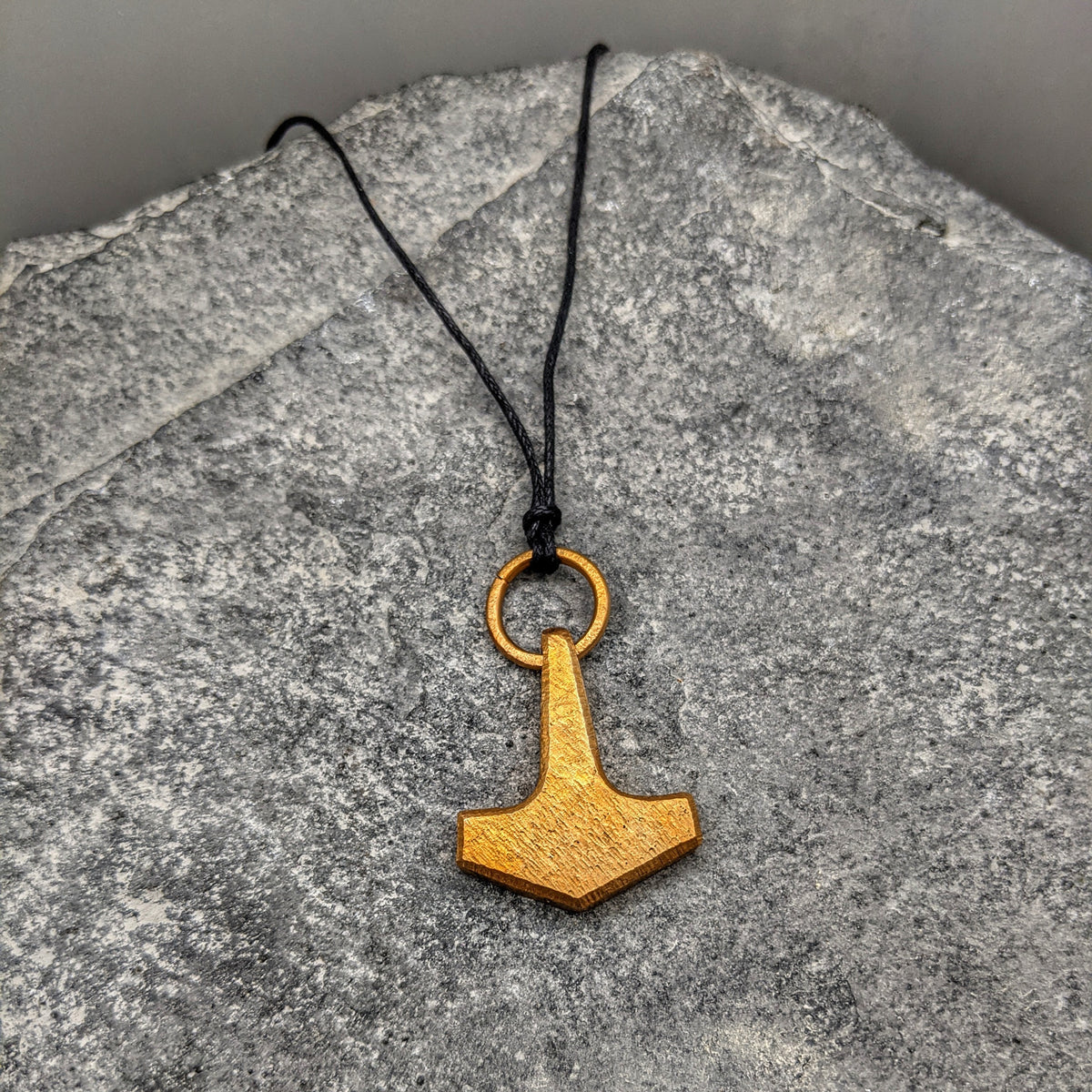 Bronze Mjölnir pendant on black leather thong, Small