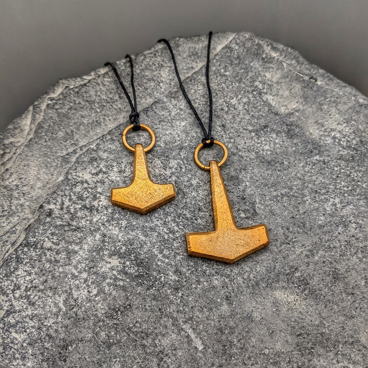 Bronze Mjölnir pendant on black leather thong, Large and Small