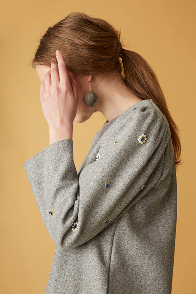bonsui model wearing a grey sweater