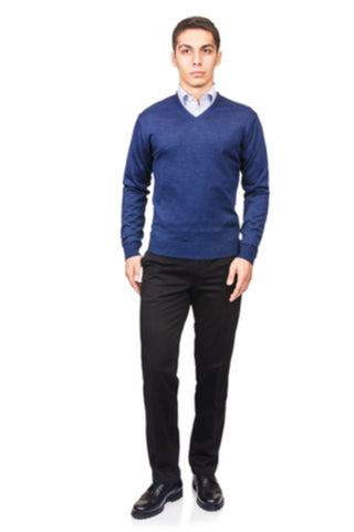 Man in blue sweater with a blue dress shirt under