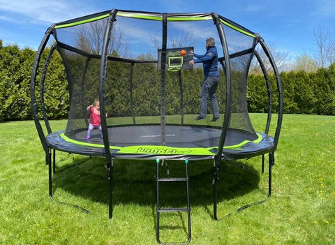 Adult playing with a toddler on a Jumpflex trampoline
