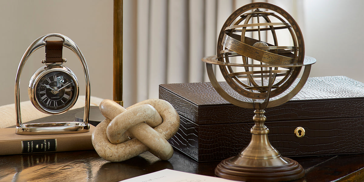 Gifts Under £250, brass globe sculpture, leather box and clock