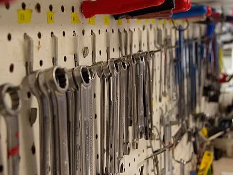 Bike repair wrenches on a wall at Bikeland