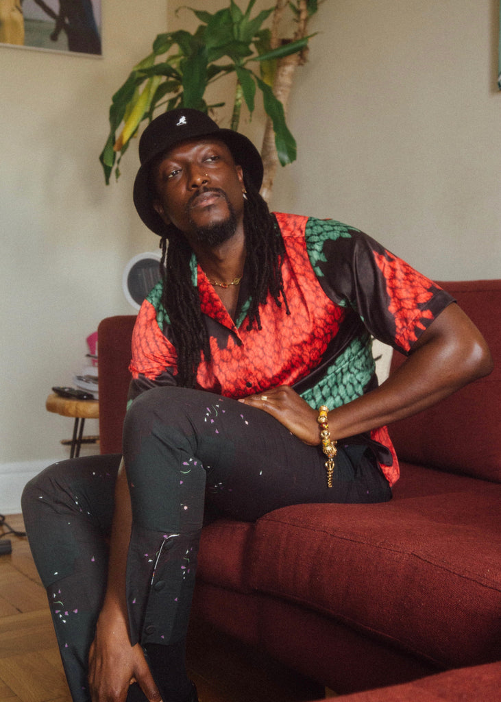 Photographer Joshua Kissi wearing luxury African fashion brand Orange Culture