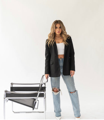 woman standing near chair