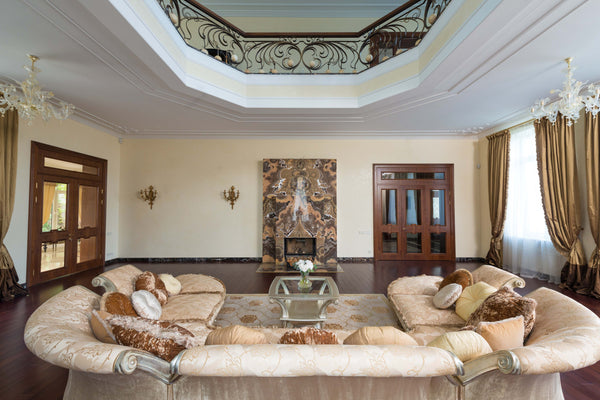 Elegant living room with cream sofa arranged in a U-shape 