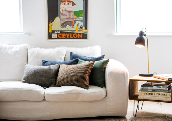 Harris Tweed cushions on a white sofa