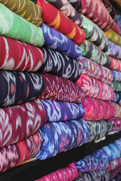 Colourful handwoven Ikat fabrics stacked
