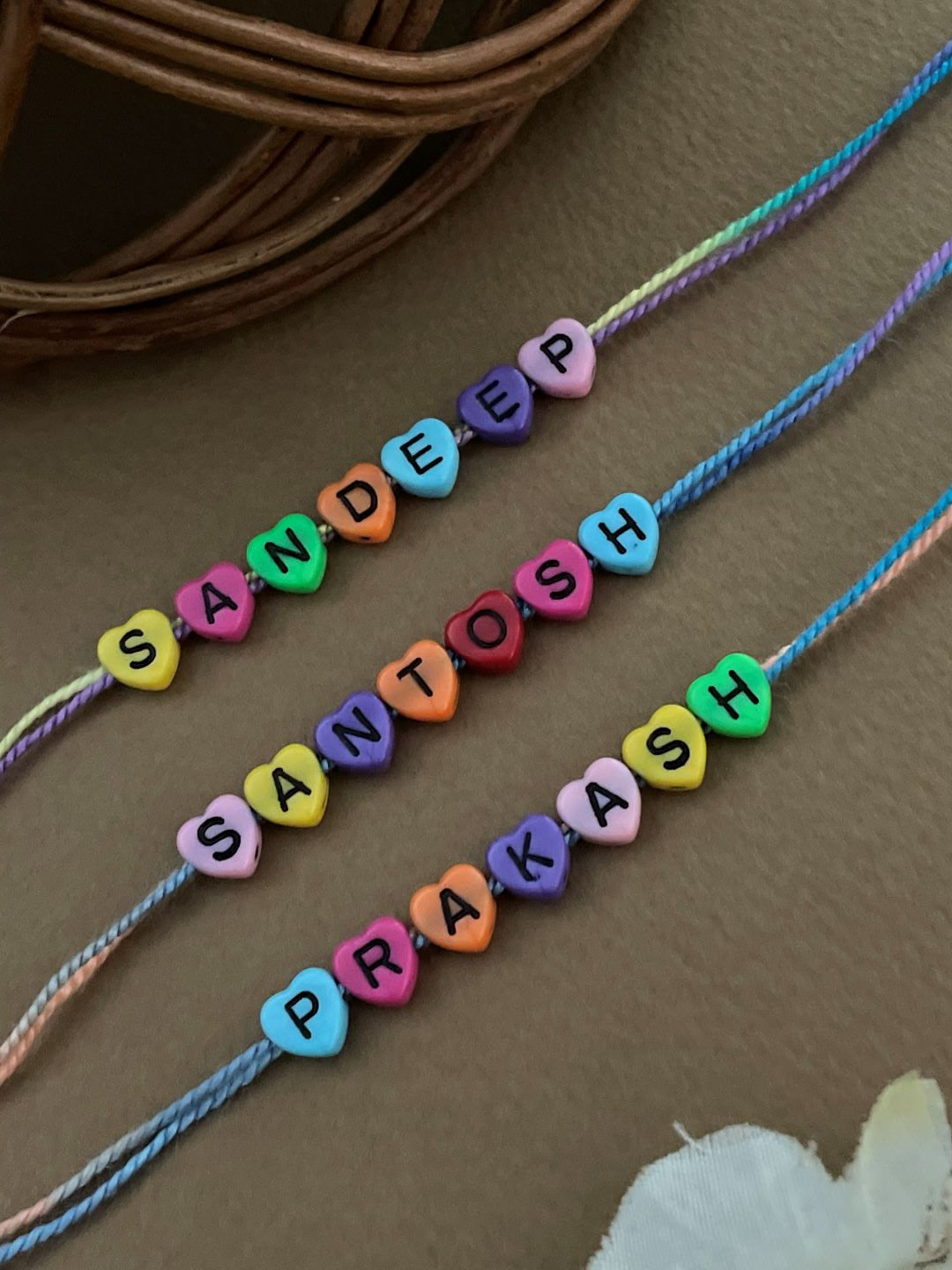 image for (Combo of 3) Custom Name Rakhi in Multcolor Color Heart Shaped Beads In MultiColor Thread