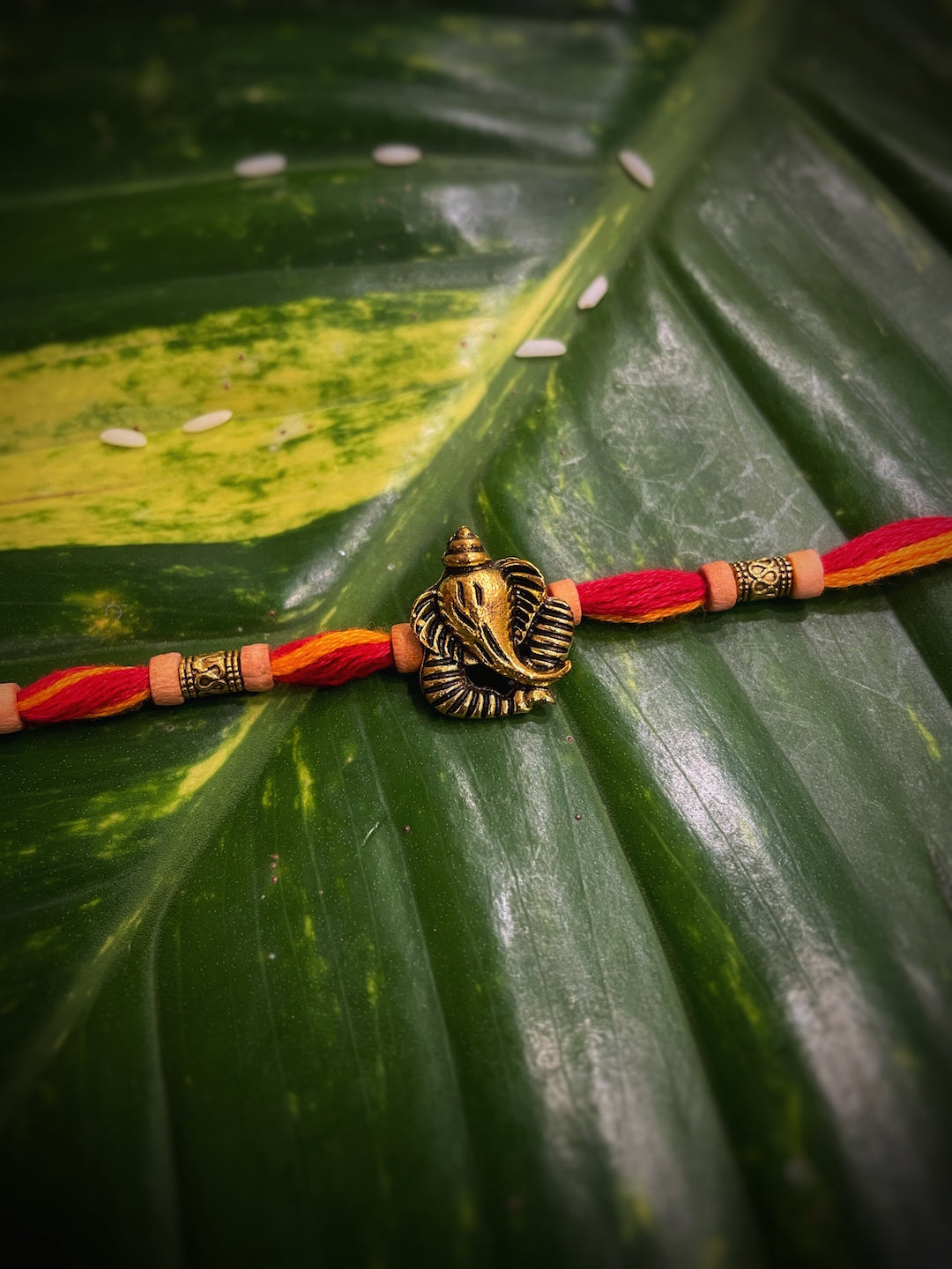 image for Trendy Designer Rakhi Ganesha/Ganesh Designs With Orange & Red Thread Rakhi For Raksha Bandhan