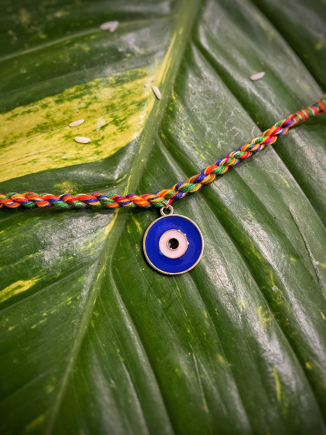 image for Turkish Blue Evil Eye Charm Fancy Rakhi With Multicolored Thread For Raksha Bandhan